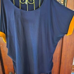Cute Navy top w/ Gold trim sleeve
